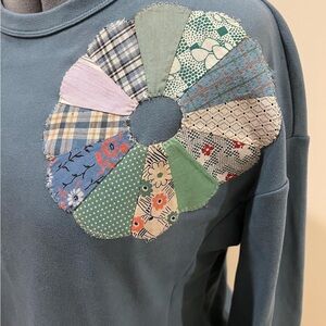 Blue sweatshirt with upcycled vintage quilt block appliqué
